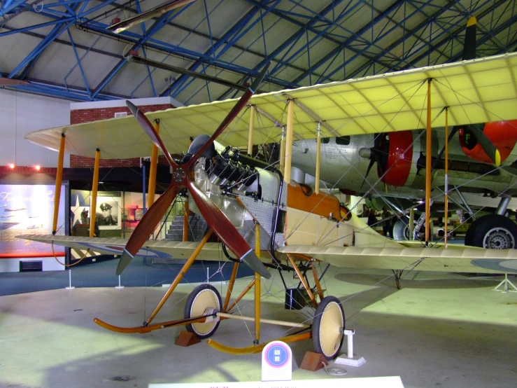 a old plane that is inside of a building