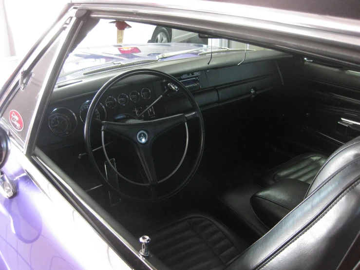 an old, black car with leather seats