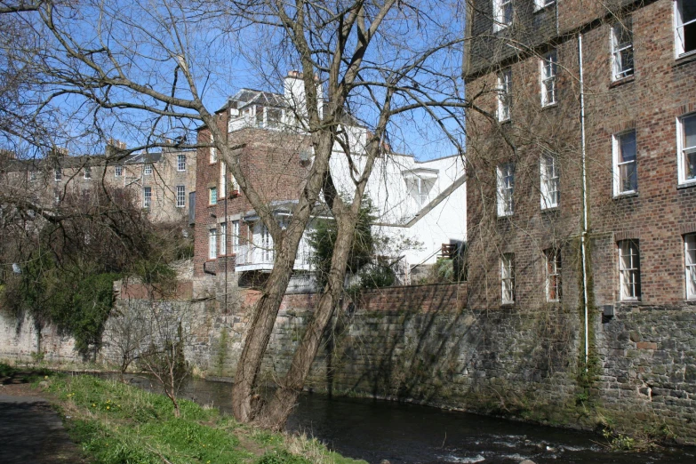 buildings along the river and a small bridge