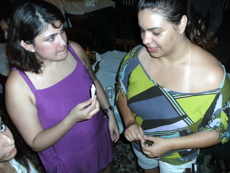 three young women standing next to each other