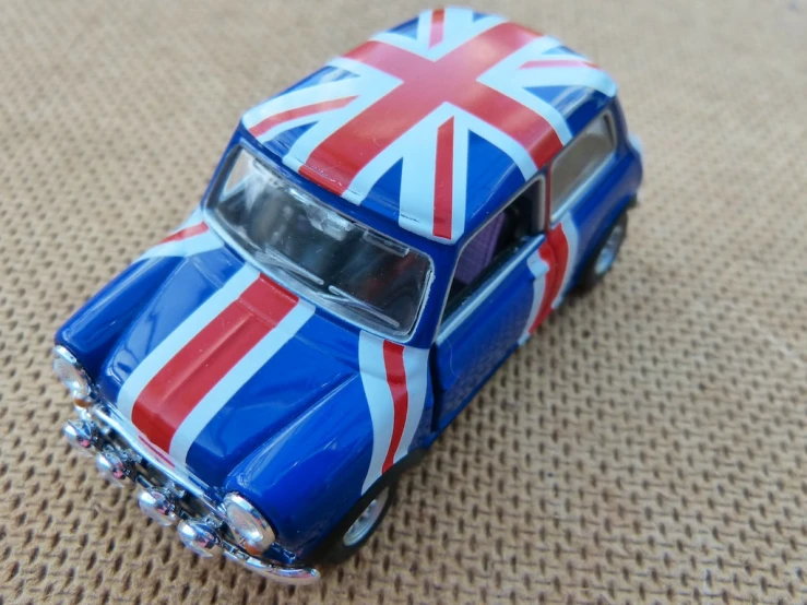 blue toy car with british flag on top