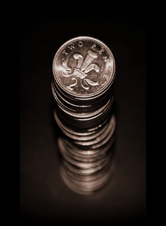 a pile of silver british coins