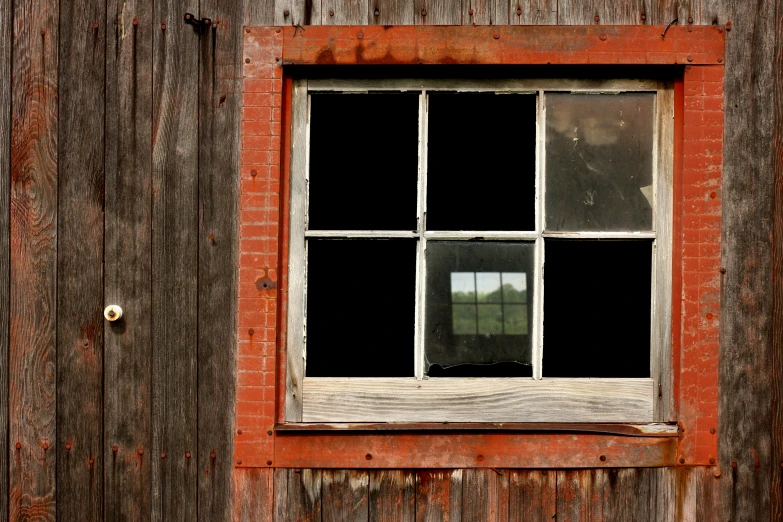 an old red brick building with several glass windows