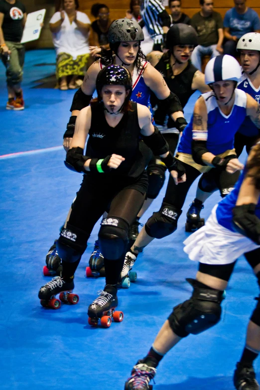 a group of people are skateboarding and skating