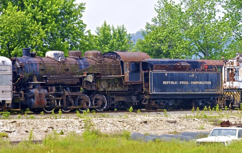 an old rusted train sits at the abandoned train depot