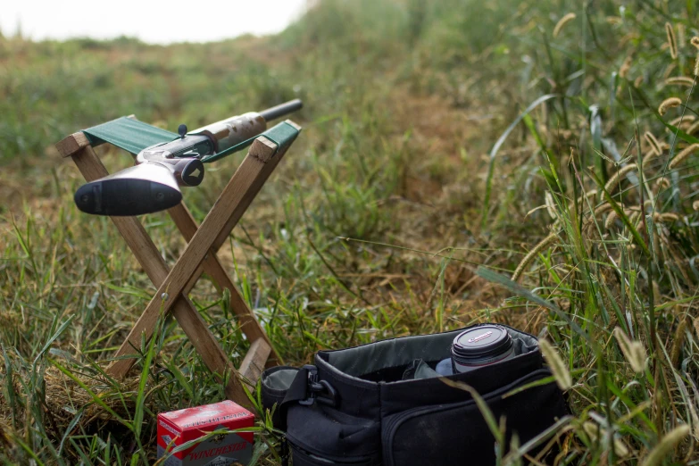 a close up of a pair of boots and an open camping table