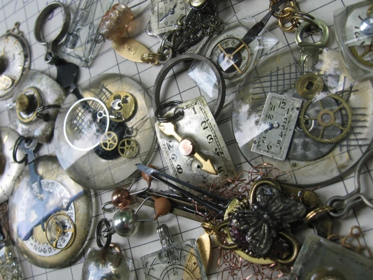 a pile of vintage clocks with hands on them