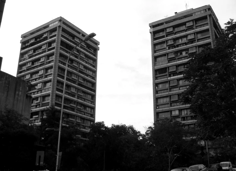 two buildings that are near each other with people in them