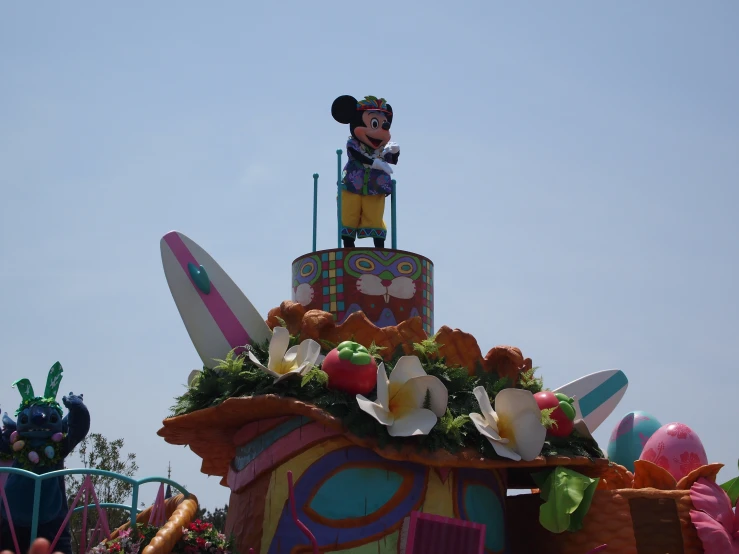 a parade float with the float at disney world in mickey mouse ears