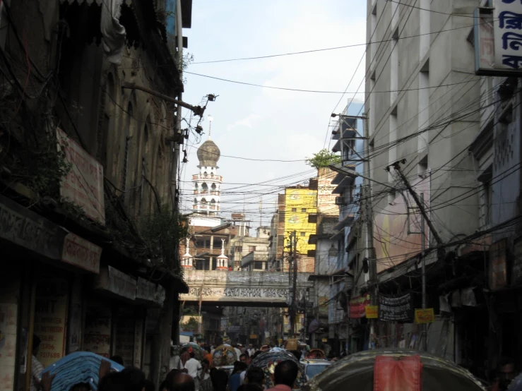 many people are walking along a street with no cars