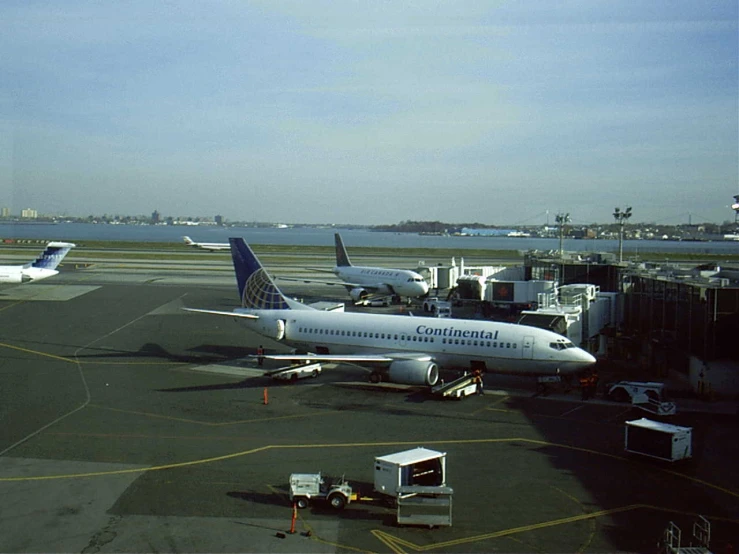 an airplane parked on the runway at the airport