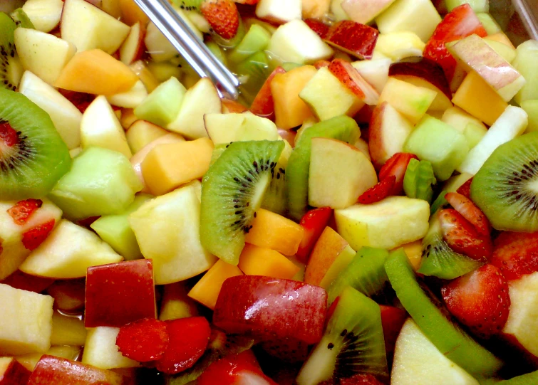 a tray that has a variety of sliced fruit