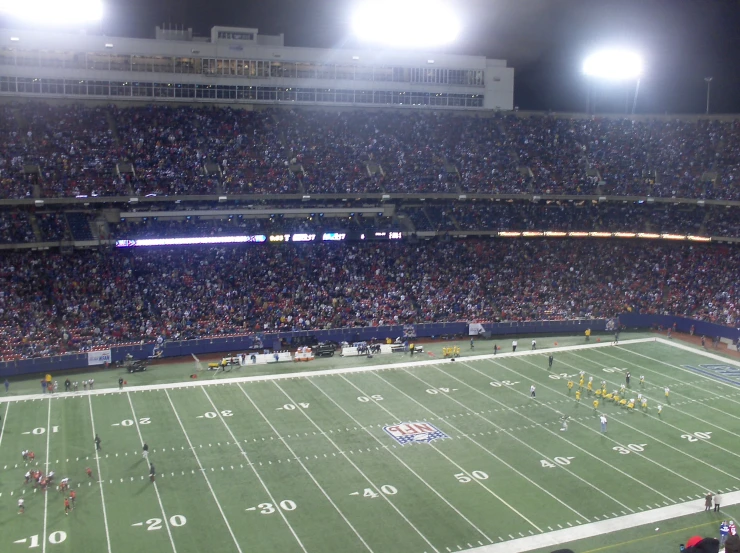 a large stadium filled with fans and people