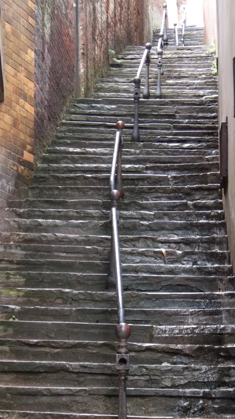stairs covered in water, next to buildings