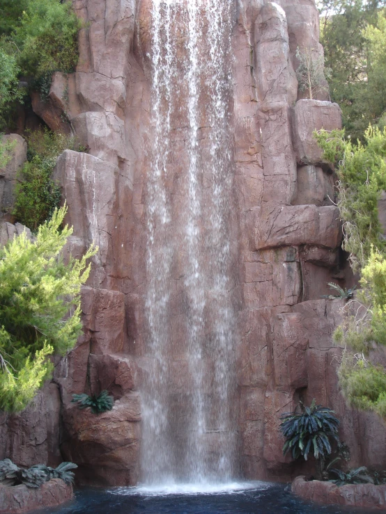 a large waterfall that is being built into some sort of cave