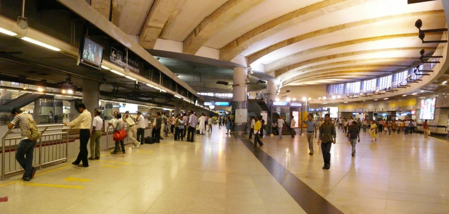 a group of people are waiting to get their luggage at the baggage claim