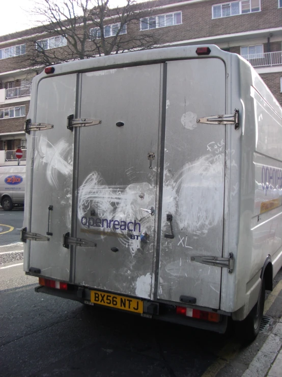 the back view of a large van parked on the street