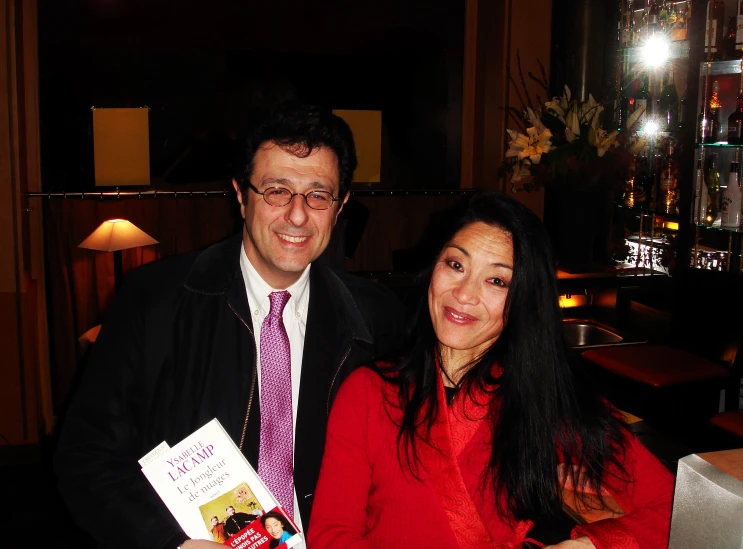 two people in front of a table at night