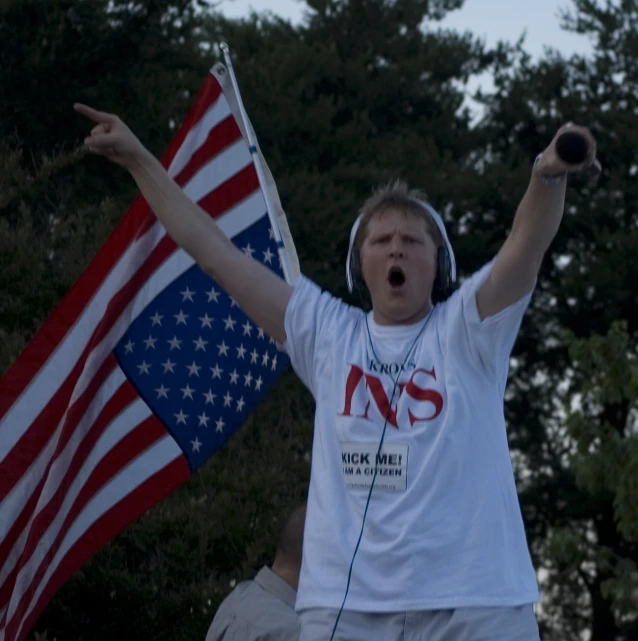 a person with headphones and an american flag