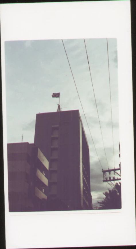 an old pograph of the side of an apartment building