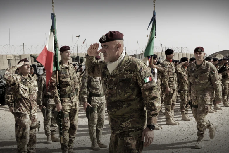 military personnel march towards their comrades on a sunny day