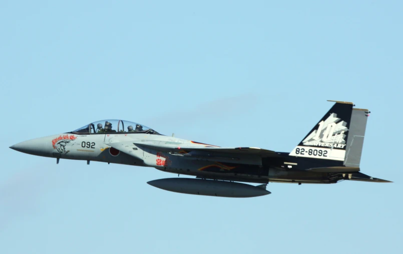 a jet airplane in flight during the day