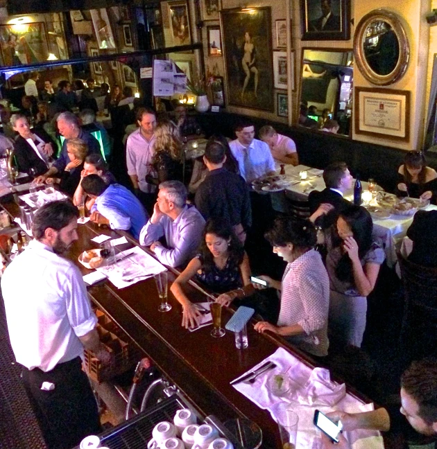 people in a restaurant eating and drinking