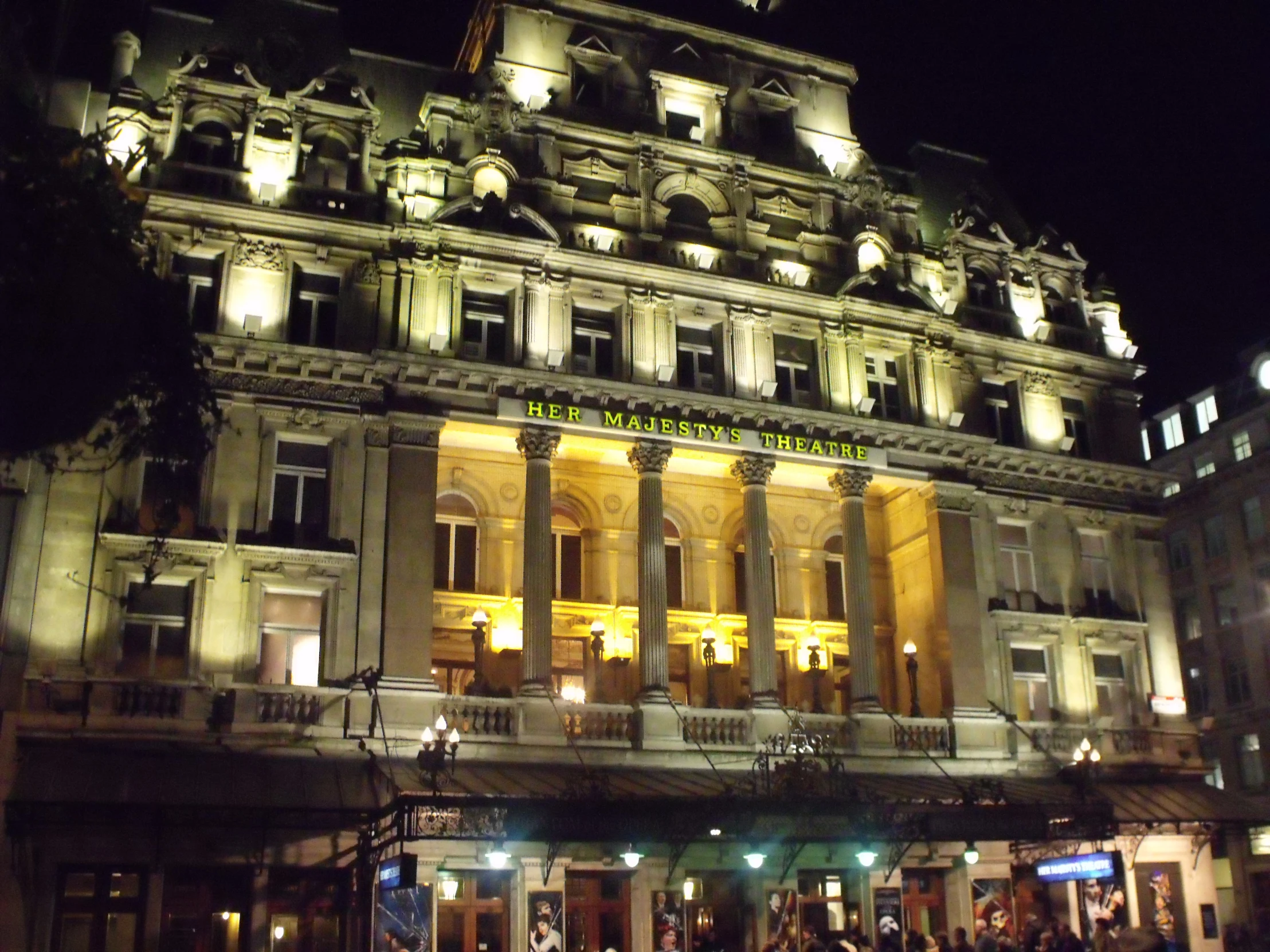 a night time view of a fancy building