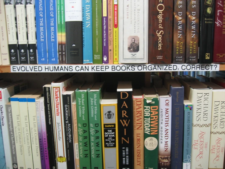 a book shelf with rows of books and words on them