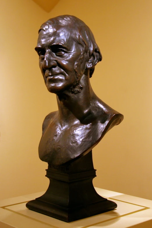 there is a large bronze bust on the pedestal
