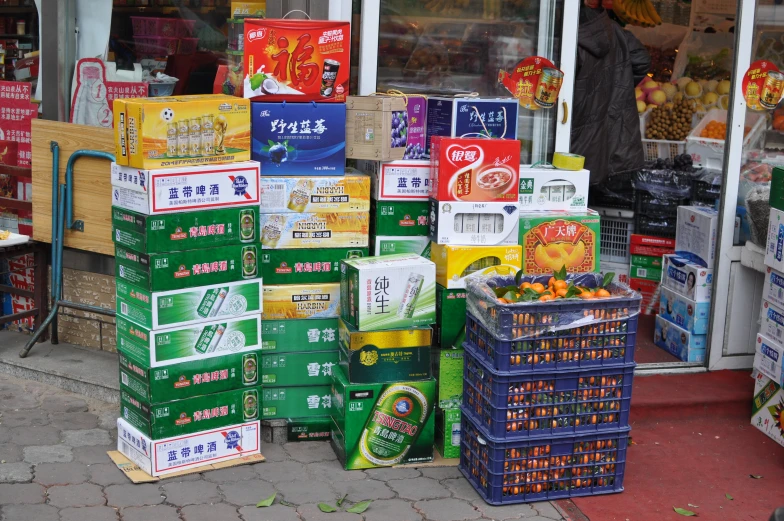 stacked containers and boxes of food in front of a store