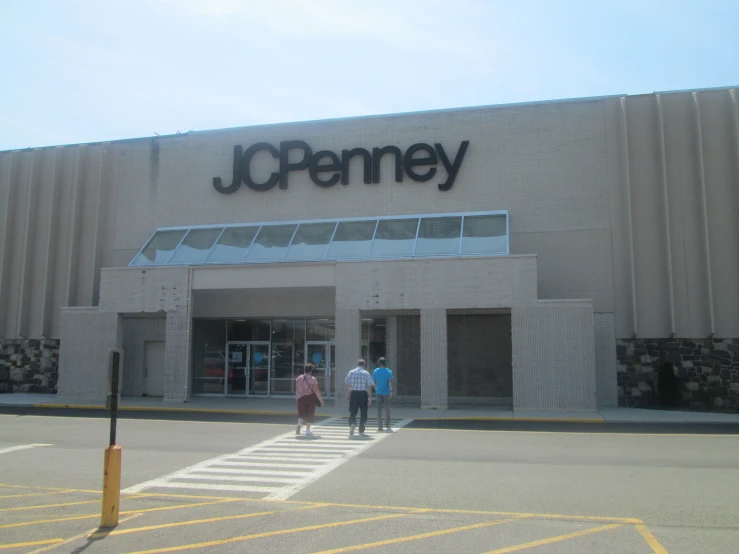 people are outside a jcpenney store that has no windows