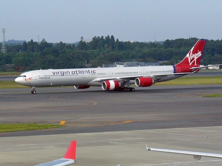 a big commercial airplane on the runway of an airport