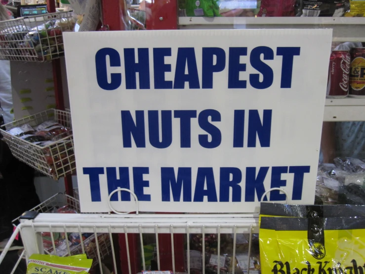a sign saying,'cheapest nuts in the market '