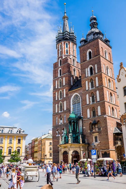 two towers with people walking down the middle