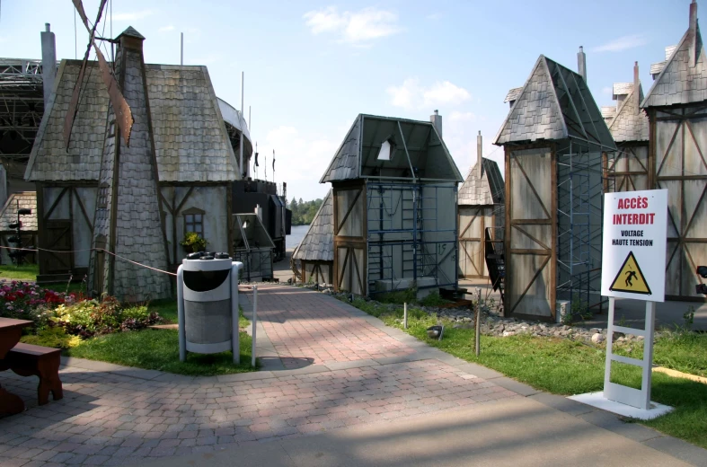 an image of a village area with wooden houses