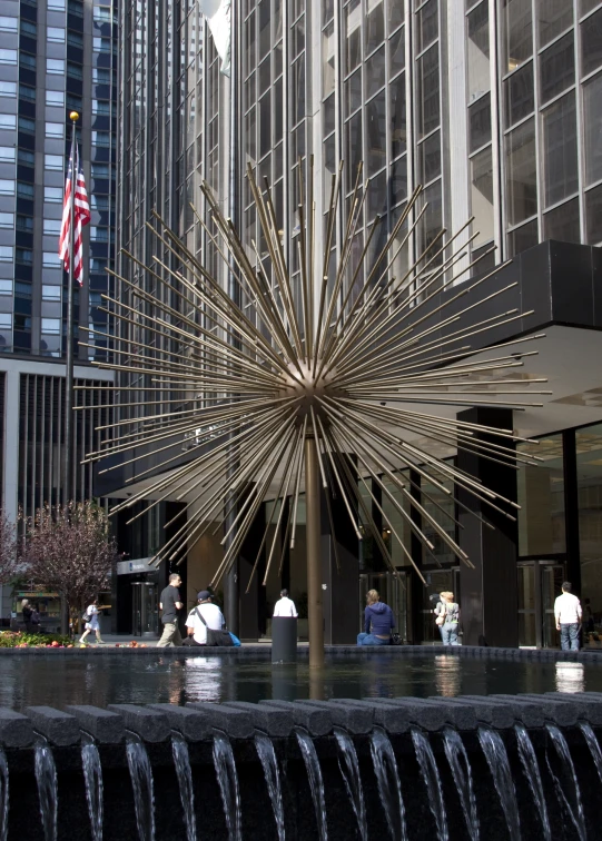 an artisticly designed fountain in the middle of a city