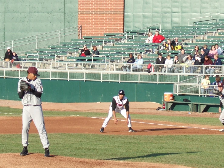 the base ball game is played outside and fans