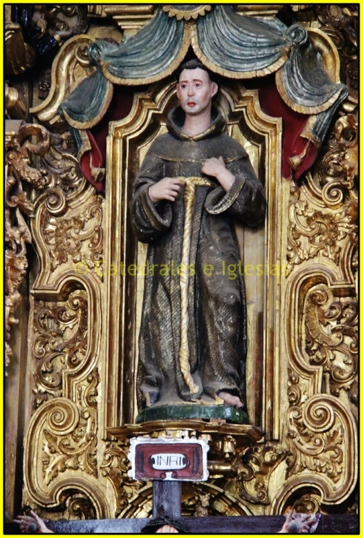 this statue depicts a saint, who is a person with his hands on his chest