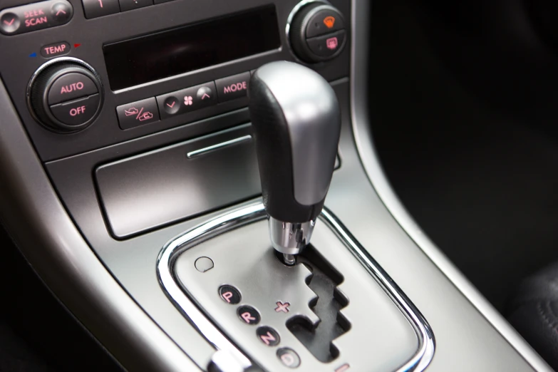 the gear pedal in a car showing a on that is pointing to a speed limit