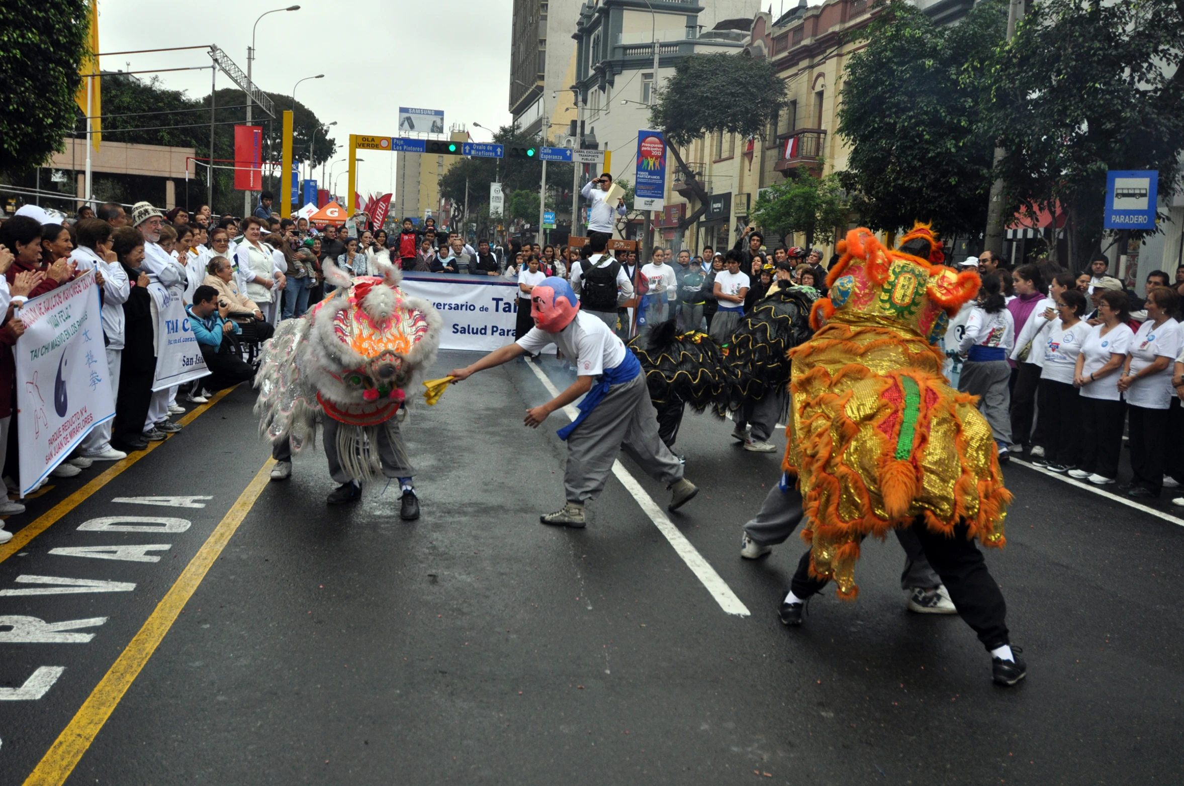 a group of people running down a street