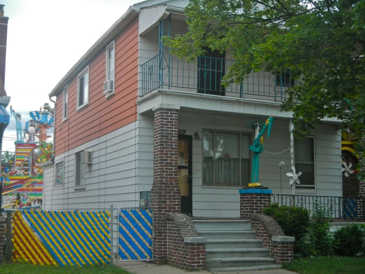 a large colorful house sitting in the middle of a street