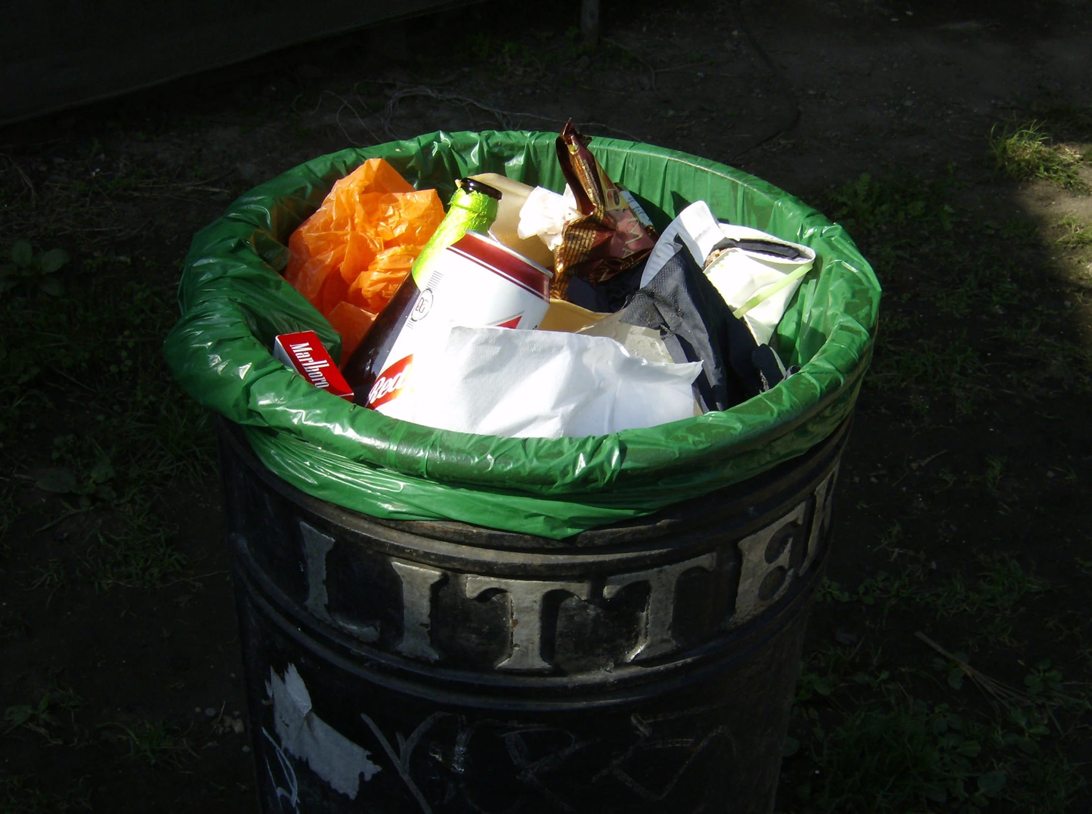 a trashcan filled with various types of garbage