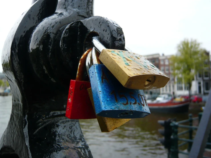 the statue shows a group of colorful locks on each padlock