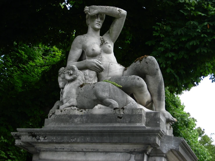 a sculpture on the outside of a stone building