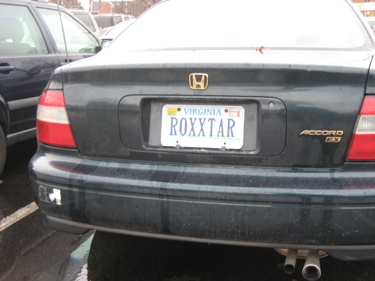 a black car with a license plate that says roxy star