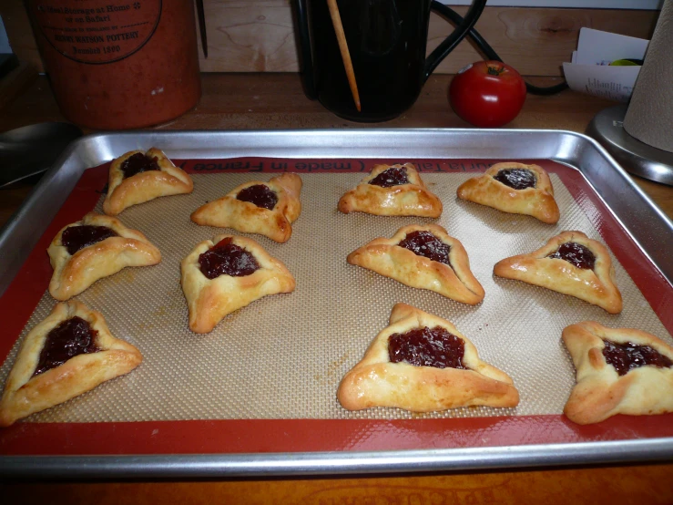 a cookie tray with a dozen small homemade pastries