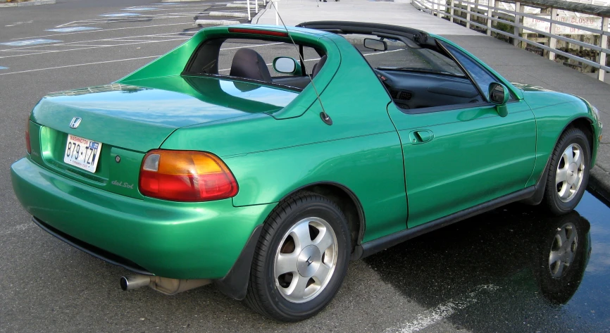 a green car is shown in this image