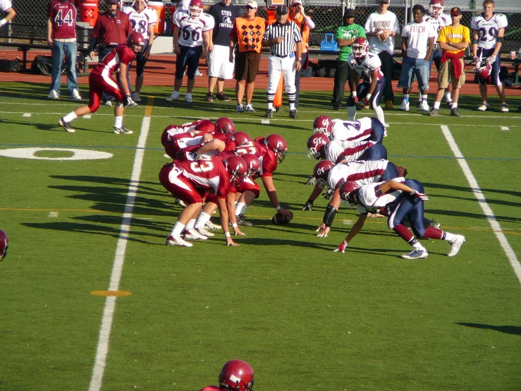 some football players are on the field and playing football