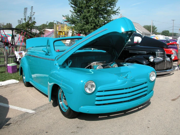 two vehicles parked side by side in a parking lot